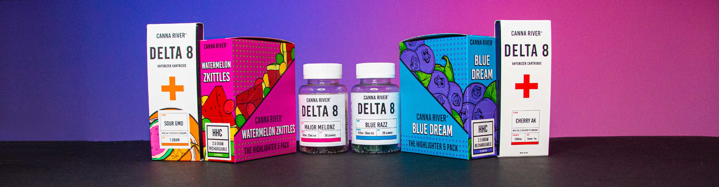 Canna River Products lined up in a row in studio room with blue and red background