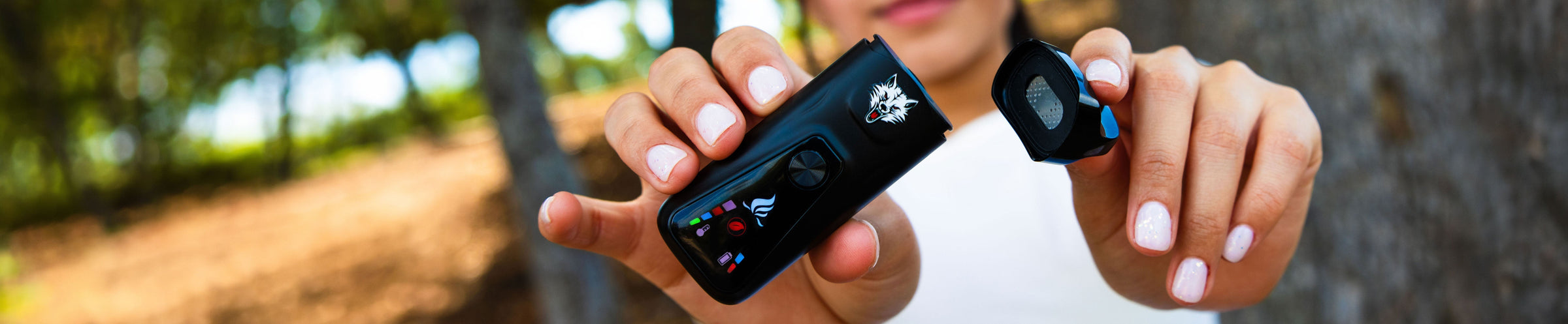 Woman holding Wulf Mods Flex Dual Use Concentrate and Dry Herb Vaporizer